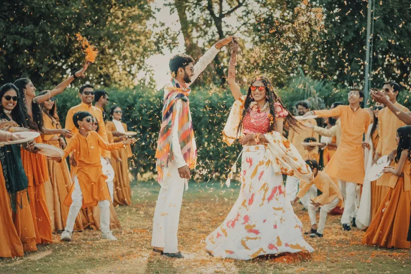 Candid laughter during the floral/turmeric shower